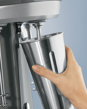 Hamilton Beach HMD0400 milkshake mixer — cup placed into position